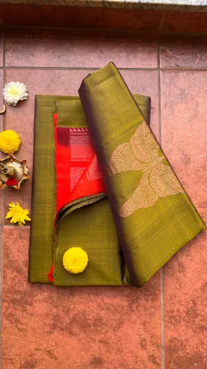 Bottle green and orange kanchipuram silk saree with blouse