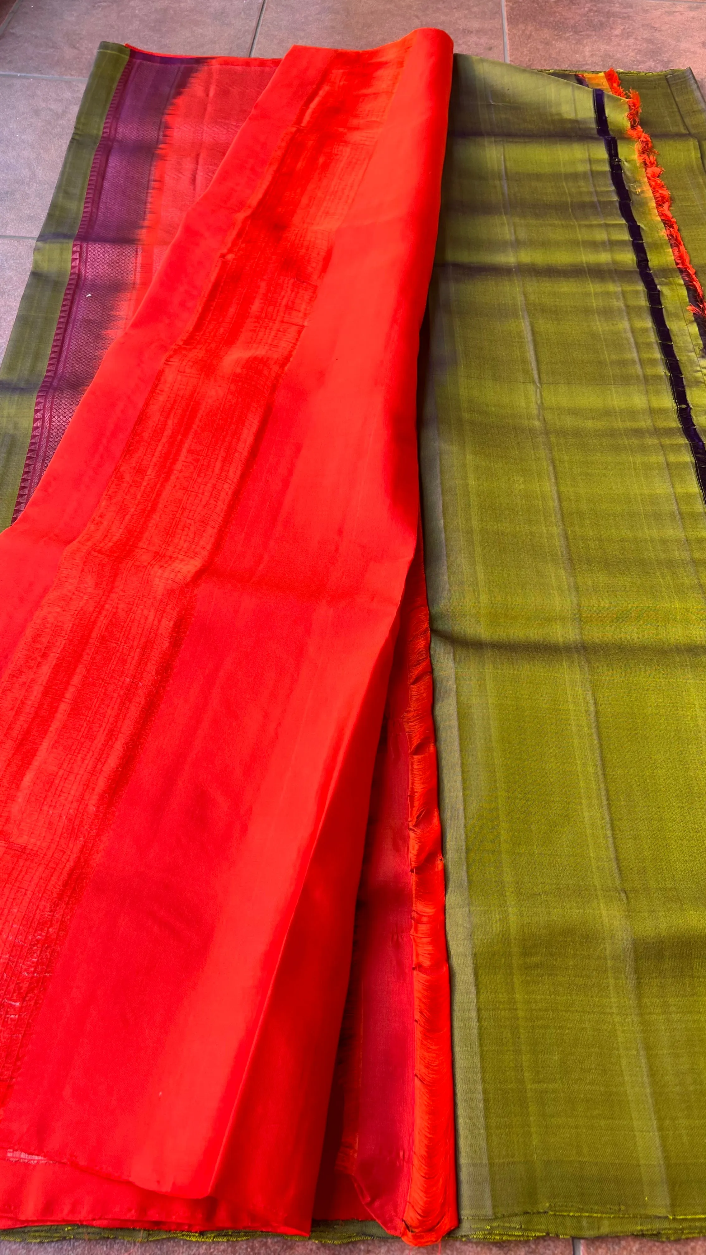 Bottle green and orange kanchipuram silk saree with blouse