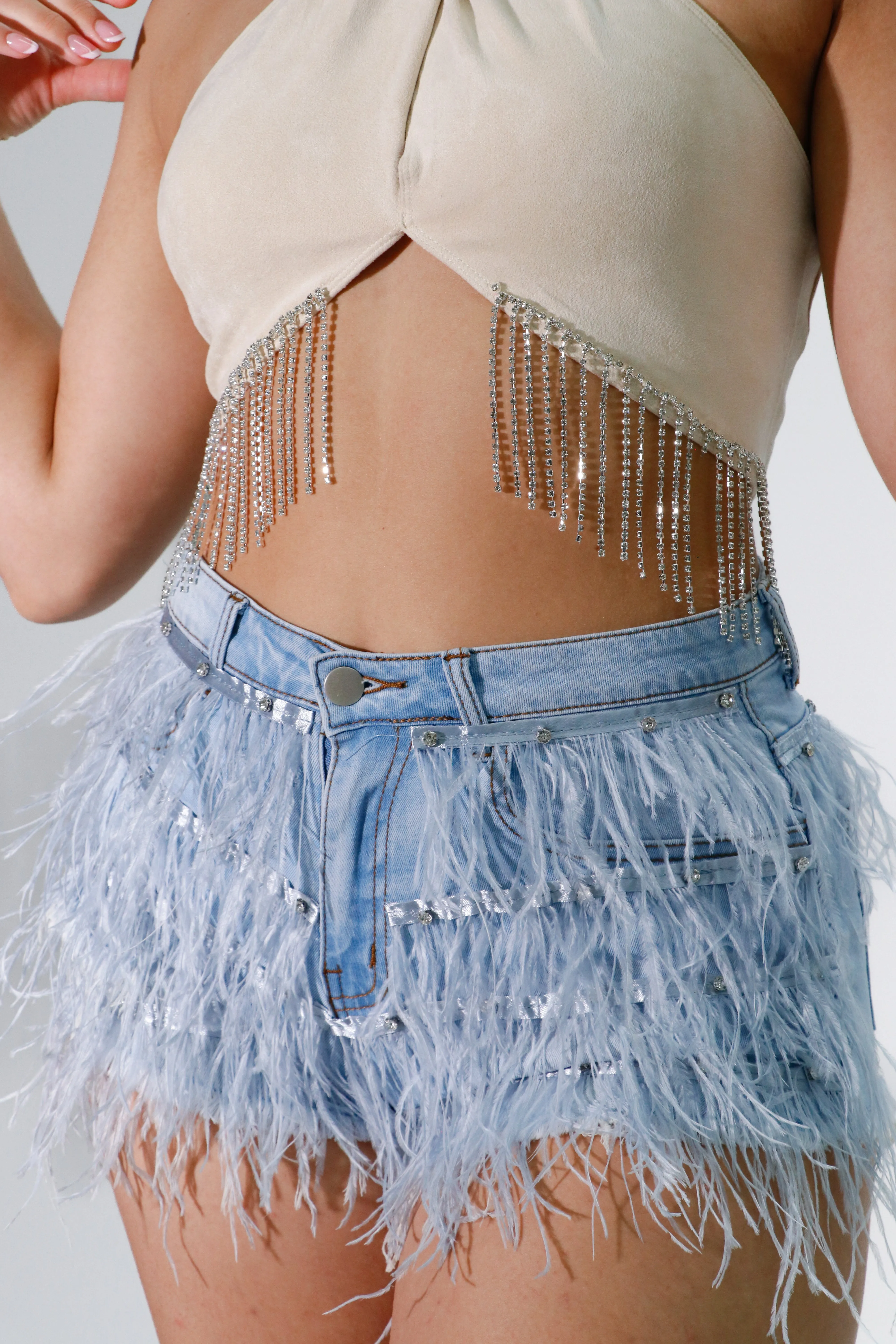 denim shorts with feathers